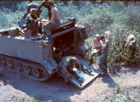 Working with Australian APC's 3Cav, MFC Larry Obrien discussing ops on ramp [no shirt] [King]