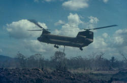 Chinook delivering large quantities of stores by underslung & internal means.  One Chinook delivered over 100 ARVN soldiers to FSPB PICTON for local training
