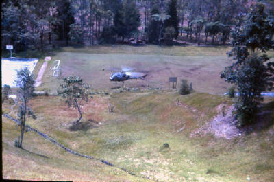 Cameron Highlands cold weather deployment - CO arriving by helicopter on bottom field below barracks    [Young]