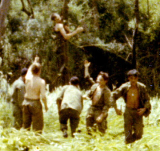 Herd in Stokes litter [bare arms] on winch 