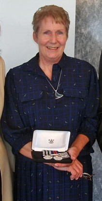 Isobel Harris is presented with the General Service Medal with Vietnam clasp and New Zealand Operational Service Medal at a ceremony at the New Zealand High Commission in London, September 2008 [NZRC]