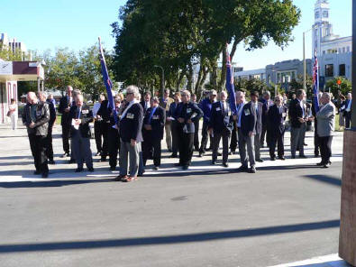 W3 contingent formed up in Palmerston North Square for combined V4/W3 memorial service - one flag is carried for each veteran killed in Vietnam.