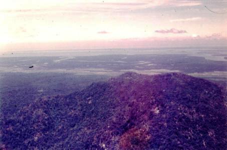 view from coastal mountains down across the flatlands  [Binning