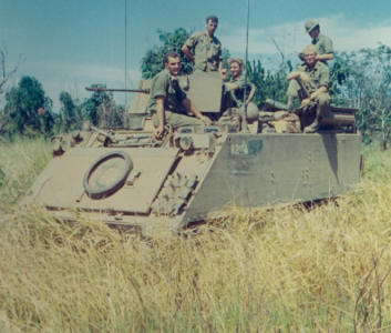 from left: Young (doing the driving) Flintoft (Aust veh comd behind gun) Cherry, Lewis (standing)