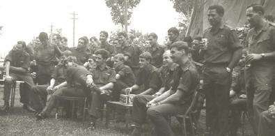from right - Padre ??, Sgt Hemana, sitting Cpl Binning, Cpl Butler, Lcpl Edwards, ?? Pte Compton, Pte Bullock, standing behind Butler Kahaki, Hatton, Cherry, Welsh, Haig-Clarke, etc  [Young]