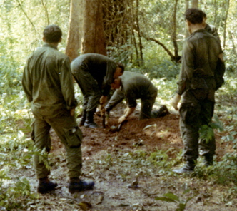 3Pl digging up the two VC bodies 