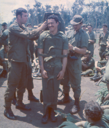 Crew demonstrating the Stokes semi-rigid stretcher [King]