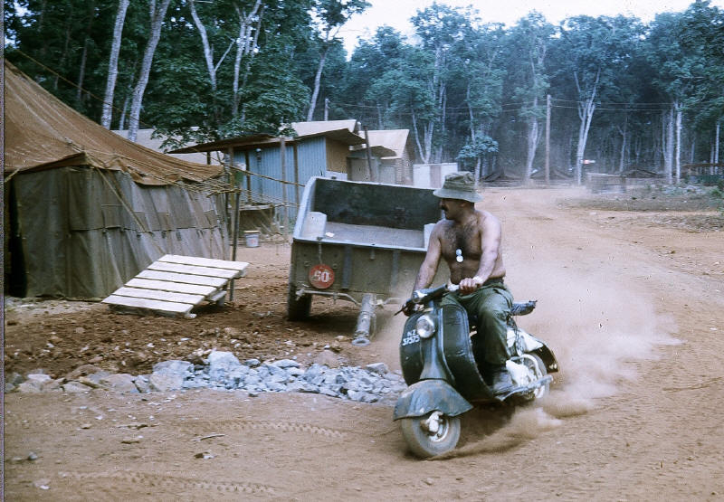 Capt Jim Brown on local transport, despite the colour & NZ37575 army number it is doubtful the scooter was on any army inventory [Stock]
