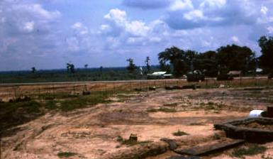 FSPB GAIL - looking across SHW15 to distinctive white buddhist statue in rear centre to left of white roof [Young] see photo of statue below