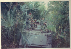 jungle bashing by APC - troops on top for observation & rapid deployment [Binning]